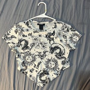 Cute crop top with sun,dragon, and letters on it